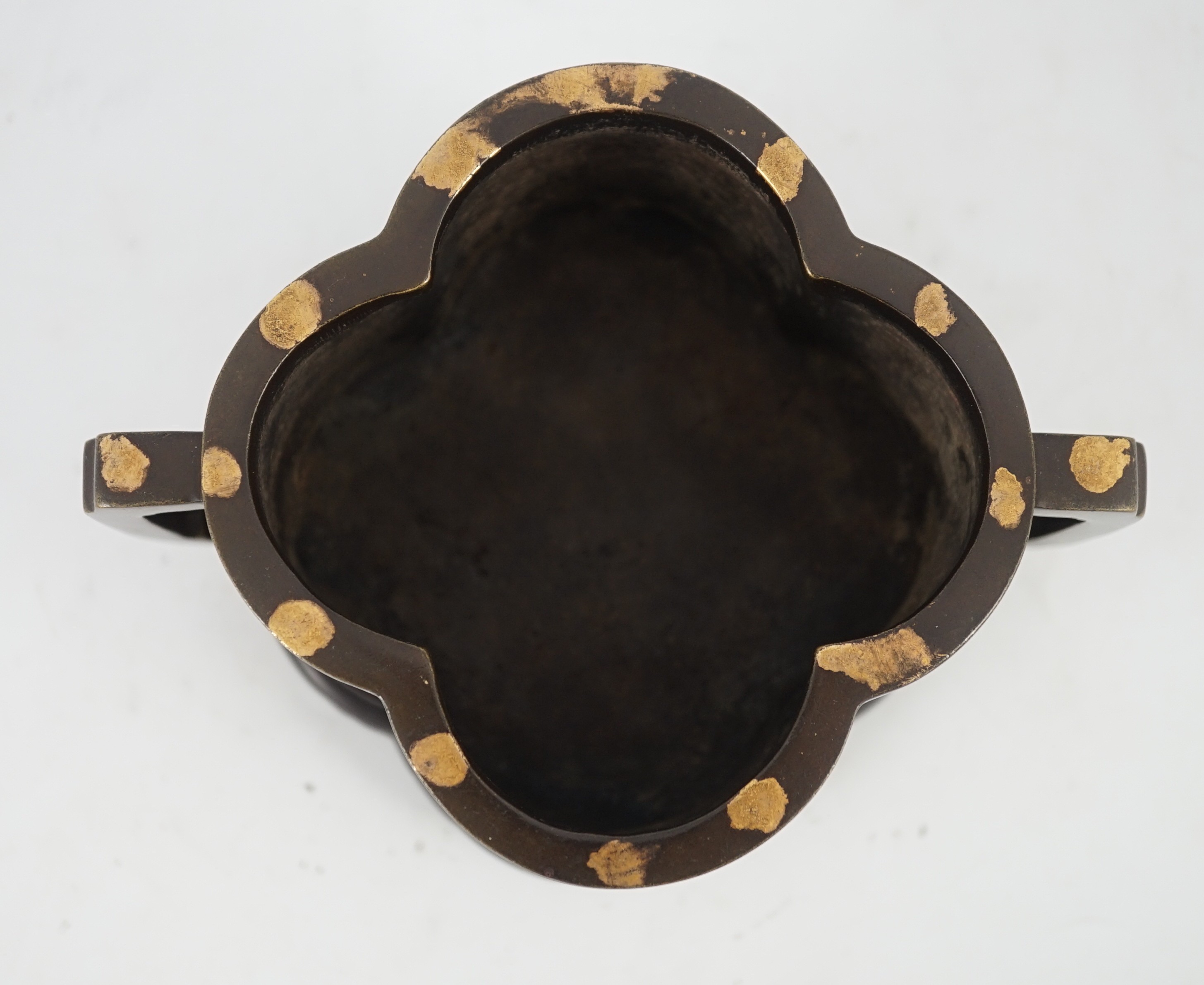 A Chinese gold splashed bronze quatrelobed censer, 17cm wide